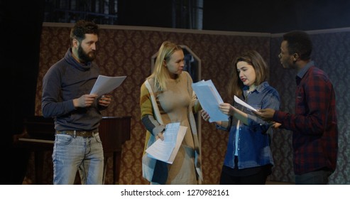 Medium shot of actors and actresses arguing during rehearsal in a theater - Powered by Shutterstock