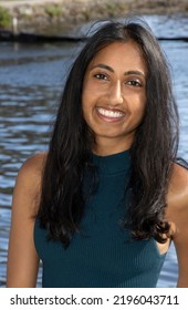 Medium Shot Of An Attractive Lady Of South Asian Descent With Shoulder Length Black Hair. 