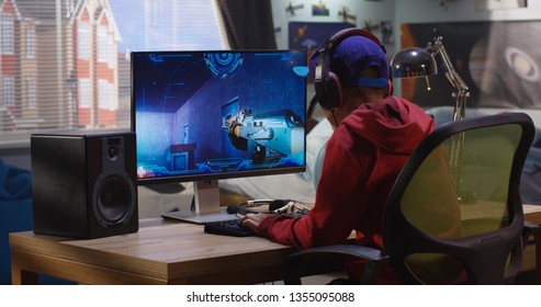 Medium shot of a boy playing with a first-person shooter video game - Shutterstock ID 1355095088