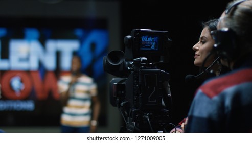 Medium Shot Of The Cameraman Shoots A Young Talent Who Sings On The Casting Of A Vocal TV Show.