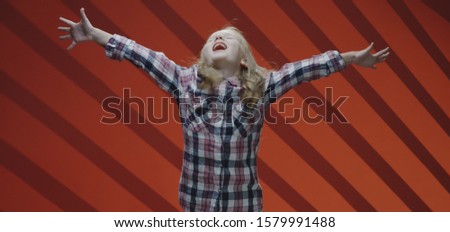 Medium shot of a child actress acting a scene in a musical