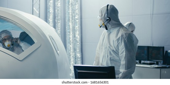 Medium shot of engineers discussing and assembling in clean room - Powered by Shutterstock - Get 15% off with code: PIKWIZARD15