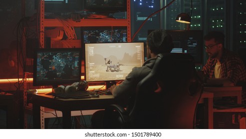 Medium shot of hackers taking control over a Mars rover - Shutterstock ID 1501789400