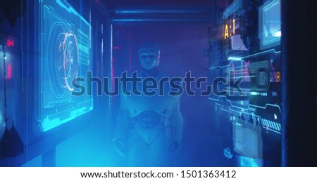 Medium shot of a humanoid maintenance robot examining holographic display in a smoke filled lab