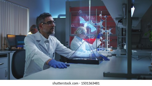 Medium shot of a male scientist examining holographic DNA chain