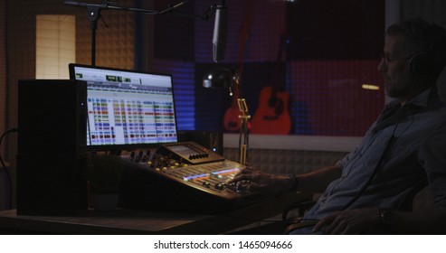 Medium Shot Of Man Recording His Own Voice Part In Studio