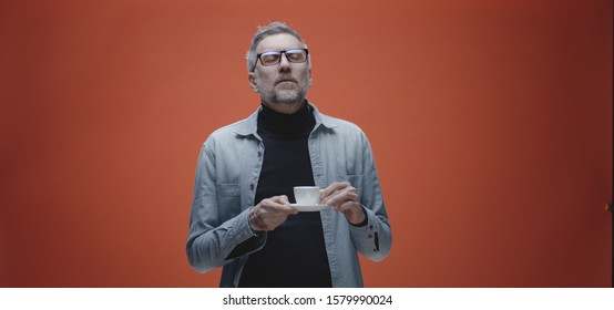 Medium Shot Of A Middle-aged Man Complaining About The Bad Taste Of His Coffee