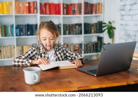 Similar – Image, Stock Photo happy school girl doing homework. Smart child working hard