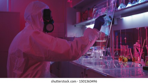 Medium shot of scientists using interactive holographic display showing DNA chain
