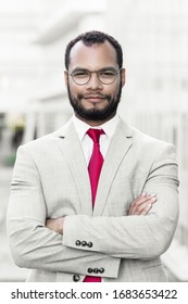 Medium shot of smiling bearded businessman. Handsome confident young man with crossed arms looking at camera. Concept of confidence - Shutterstock ID 1683653422