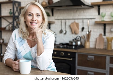 Medium Shot Smiling Woman Holding A Mug