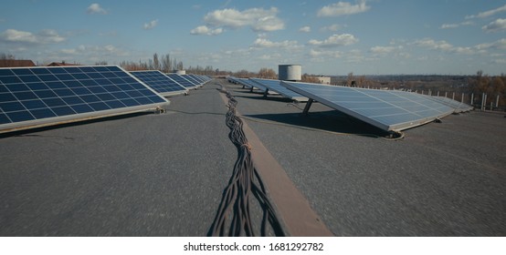 Medium Shot Of Solar Panels On Flat Roof