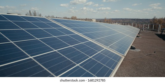 Medium Shot Of Solar Panels On Flat Roof