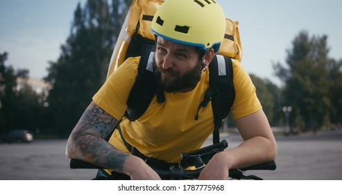 Medium Shot Of A Tired Bicycle Messenger Taking A Break