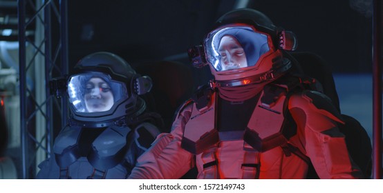 Medium Shot Of Two Astronauts Experiencing Increased G Force In Accelerating Spaceship