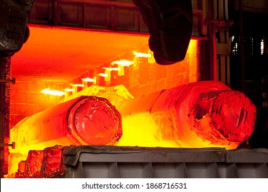 A medium shot of two hot molten forged steel rods in a furnace. - Powered by Shutterstock