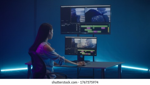 Medium shot of video editor working at her workstation - Shutterstock ID 1767375974