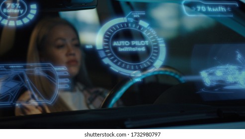 Medium shot of woman activating self driving mode in car - Powered by Shutterstock