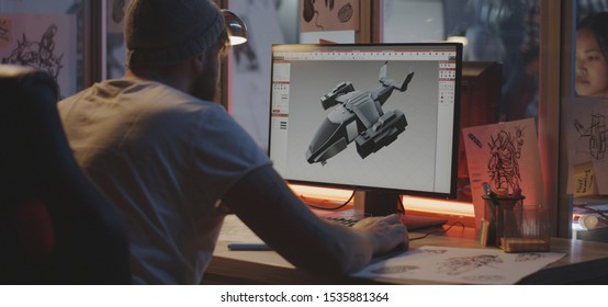 Medium Shot Of A Young Man Modeling An Airplane On Computer