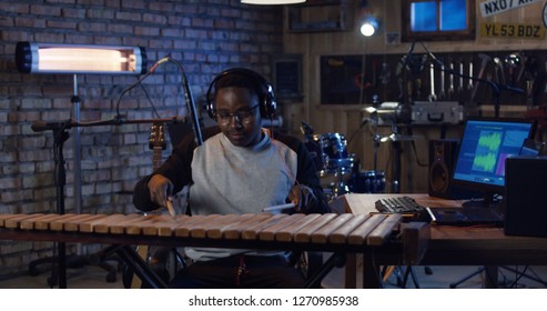 Medium Shot Of Young Marimba Player Recording Music In Home Studio