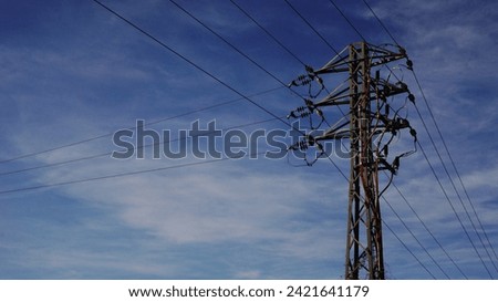 medium voltage electric metal tower against the sky
