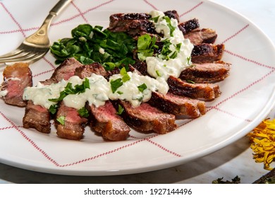 Medium-rare Sirloin Steak With Gorgonzola Sauce And Steamed Spinach