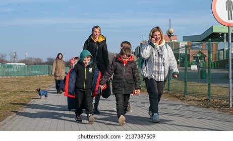 Medyka, Przemyśl, Poland, 20 March 2022: Group of refugees from Ukraine escaping from war. Ukrainian refugees crossing the border. Ukrainians fleeing the war.