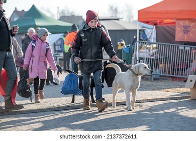 Medyka, Poland - March 17, 2022: Refugees From Ukraine Arriving At Ukrainian-Polish Border Crossing In Medyka. People Fleeing The War In Ukraine