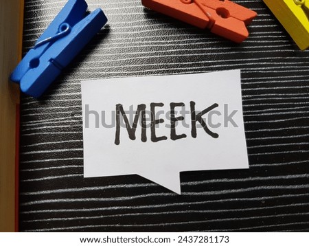 Meek writting on table background.