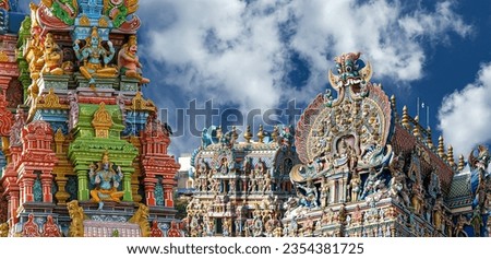 Meenakshi hindu temple in Madurai, Tamil Nadu, South India. Sculptures on Hindu temple gopura (tower). It is a twin temple, one of which is dedicated to Meenakshi, and the other to Lord Sundareswarar