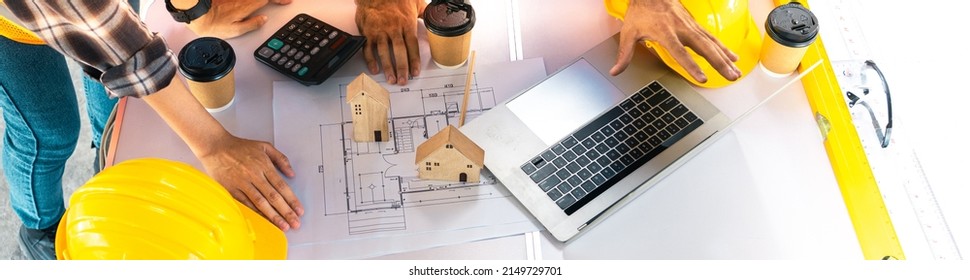 Meeting Of The Architect Team To Design Houses And Buildings.Banner For Writing Of The Engineering Drafting Team Worker And Project Manager.Top View Of Construction Design Meeting Table,PPE,Hardhat.