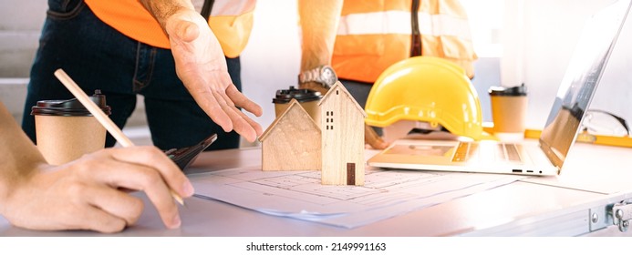 Meeting Of The Architect Team To Design Houses And Buildings.Banner For Writing Of The Engineering Drafting Team Worker And Project Manager.Top View Of Construction Design Meeting Table,PPE,Hardhat.