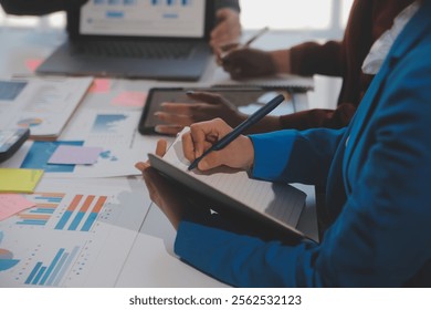 Meeting of business executives discussing analysis of the company's financial situation and business planning with partner collaboration and consultation of strategy.