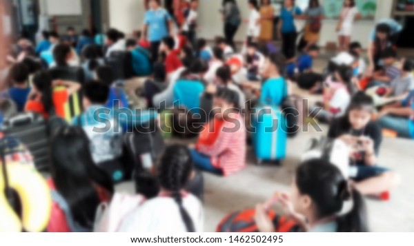 Meeting of children preparing luggage in the\
summer camp, blurred\
images.