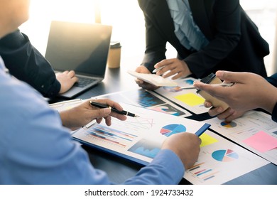 Meeting concept Business team hands at working with financial plan, meeting, discussion, brainstorm with tablet on the office desk,  - Powered by Shutterstock