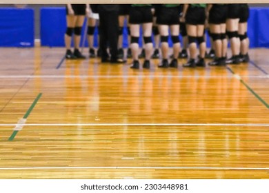 Meeting in a corner of the court after a volleyball game - Powered by Shutterstock