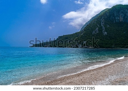 The meeting of the deep blue sea and green mountains in the ancient city of Olympos