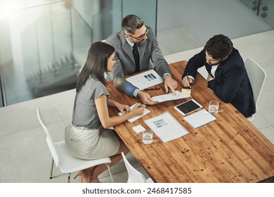 Meeting, discussion and business people with paperwork in office for review, budget report or project proposal. Lens flare, corporate consultant and staff for conversation, sales graph or teamwork - Powered by Shutterstock