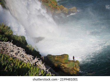 Meeting Of Fresh Water With Salt Water. Angling Under The Falling Waters Of The Düden Waterfall In Antalya, Türkiye.