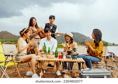 Meeting for fun vacation trips camping trips natural places : Happy group male and female friends singing songs and drinking beer having fun on vacation travel camping holiday trips natural fields. - Powered by Shutterstock