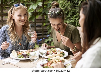 Meeting of girls at the fashion restaurant  - Powered by Shutterstock