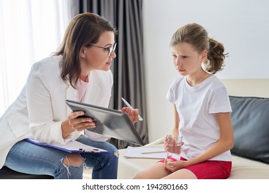 Meeting of pre-teen child girl and female social worker psychologist teacher at office - Powered by Shutterstock