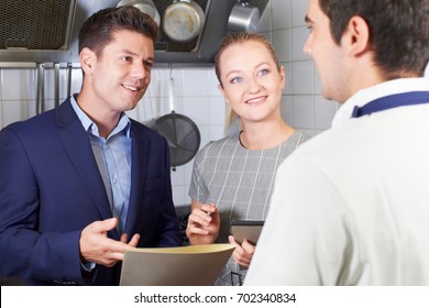 Meeting Of Restaurant Team In Kitchen