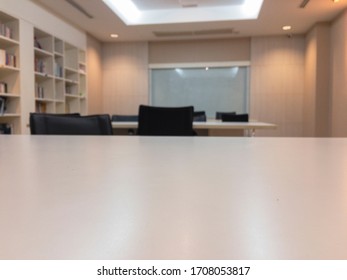 Meeting Room Or Auditorium Or Multipurpose Room With Desks And Chairs And Bookshelves And Whiteboard But No People In The Room