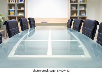 Meeting Room With Glass Top Table And Armchairs, Office Interior