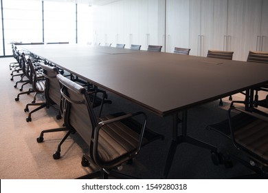 Meeting room professional board room lit by natural light chairs and table modern office fitout