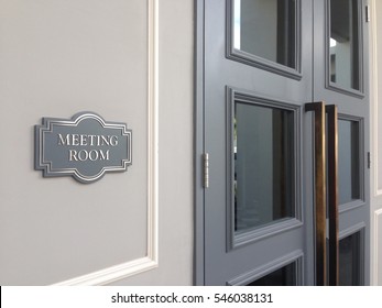 Meeting Room Sign Hanging Near The Grey Door With Pull Handles Square. The Front Of New Modern Room For Office Conference. 