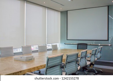 Meeting room with white curtain, shutters, blind, roller.