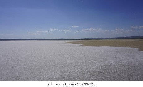 The Meeting Of Salty And Dry Lake Ground. The Center Of Salt Lake (Tuz Golu), Turkey. Dried Lake Landscape Under Clear Blue Sky. Coming Together. Difference Concept Between Two Sides.
Diversity.