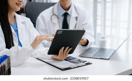 Meeting team of Asian doctor and medical staff Consultation about the treatment of heart disease, pneumonia, gastrointestinal and stomach diseases. and osteoporosis at hospital
 - Powered by Shutterstock